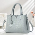 Square embossed leather crossbody bag in grey-blue with V-logo and metal pendant - Blue