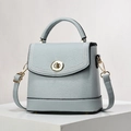 Light blue-grey lychee grain bucket bag with gold hardware and white stitching details - Sky Blue
