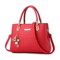 Red crocodile pattern leather handbag with gold logo and pearl heart charm accessory - Burgundy
