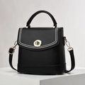 Black lychee leather bucket bag with white stitching and gold clasp in variant view - Black