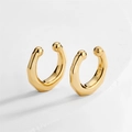 Detail of geometric gold ear cuffs with spherical ends on white minimalist stone surface - Gold Faceted Minimalist Ball Ear Cuff (EP5620B)