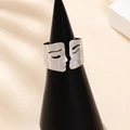 Artistic face profile open ring with hammered silver texture on elegant display - Adjustable Open / Silver