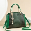 Deep green crocodile embossed patent leather handbag with gold charm and shoulder strap - Green