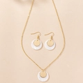 Detailed view of elegant gold-toned shell pendant necklace and matching drop earrings - Gold