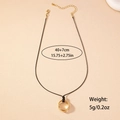 Geometrische Halskette mit drei goldenen Ringen und verstellbarer schwarzer Schnur - Kurz (40+7cm) / Goldgelb