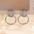 Close-up of silver lion head door knocker earrings with detailed metal texture - Silver