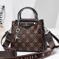 Detail of printed large capacity handbag with silver metal handles and star charm pendant - Dark Brown/Black Contrast Letter Pattern (Style 6)