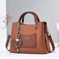 Brown litchi grain PU leather handbag with FASHION Queen print and heart charm - Earthy Yellow
