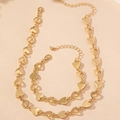 Detail of gold heart pendant necklace and bracelet set with adjustable lobster clasp - Gold