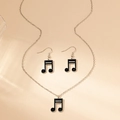 Detailed view of silver music note necklace and hook earrings set with black enamel - Black