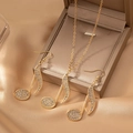 Set gioielli nota musicale placcato oro con strass su tessuto satinato champagne - Oro