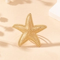 Golden starfish ring with detailed bead texture for a summer beach vacation style look - Gold