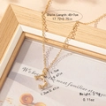 Detail of bamboo texture alphabet pendant on a thin gold chain with measurements - Letter J