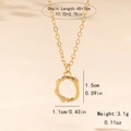 Detail view of gold bamboo texture ring pendant with measurements 45+7cm chain length - Letter O