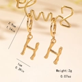 Detail view of gold bamboo texture letter H earrings with size and weight measurements - Letter H Style