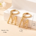 Detailed view of gold bamboo texture letter M earrings showing size 2.7cm in height - Letter M Style