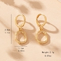 Bamboo style gold huggie earrings with round pendants showing 2.8cm height measurement - Letter O Style