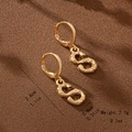 Detailed view of golden S-shaped bamboo textured drop earrings with size specifications - Letter S Style