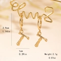 Detailed view of bamboo style letter T gold drop earrings with size measurements - Letter T Style