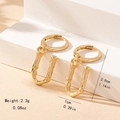 Detailed view of golden bamboo textured hoop earrings with dimensions 2.9cm and 2.3g weight - Letter U Style
