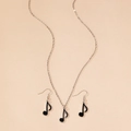 Detail of silver musical note jewelry set with black enamel pendant and earrings - Black Eighth Note 2-Piece Set