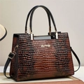 Bolso de mano marrón oscuro con relieve de cocodrilo y herrajes dorados en base - Amarillo Tierra