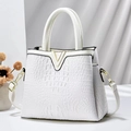 Detail of white crocodile texture leather handbag with gold V-shaped metal hardware - Off White