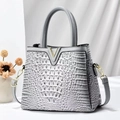 Gray crocodile texture handbag with gold V-shaped buckle and cylindrical handle - Gray