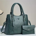 Detail view of a vintage dark green handbag set with textured PU leather and silver hardware - Green