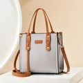 Bolso de mano bicolor con borla en gris claro y marrón con etiqueta Taihong - Gris