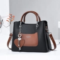 Large black pebbled leather tote with brown pocket and Fashion Queen print details - Black
