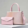 Detailed view of pink crocodile pattern tote bag with matching envelope clutch set - Pink