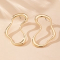Detailed view of gold irregular abstract stud earrings with polished finish and soft shadows - Gold