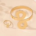 Polished gold infinity spiral arm cuff and matching ring set on a stone surface - Golden 2-Piece Set (Bangle + Ring)