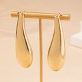 Elegant gold teardrop earrings with textured finish and minimalist aesthetic design - Gold
