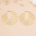 Detailed view of gold multi-layered circular earrings with hammer-textured hollow design - Gold Yellow