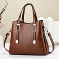 Vintage brown leather handbag with silver metallic accents and detachable shoulder strap - Brown