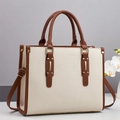 Detail of woven texture contrast trim tote bag with leather strap and golden hardware - Off-white