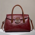 Retro burgundy crossbody handbag with V-logo metal buckle and brown top handle - Red