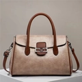 Detail view of khaki and brown拼接 tote bag with metallic V logo and lychee texture - Khaki