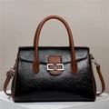 Classic black leather tote bag with brown handles and elegant V-shaped metal buckle - Black