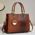 Detail of lizard embossed leather handbag with golden hardware and swan pendant - Earthy Yellow (806-2#)