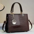 Detailed macro of dark brown glossy lizard-textured handbag with golden swan charm - Coffee (806-2#)