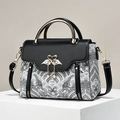Chic graffiti print handbag with gold swan clasp and tassel charm for women - Black