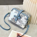 Detailed view of paisley print crossbody bag with triple zippers and gold hardware - Retro Paisley Print / Blue