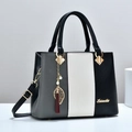 Bolso de mano tricolor de cuero a rayas con colgante de borla de hoja y bandolera - Negro