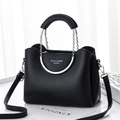 Fashionable black leather chain handbag with silver U-handle and crossbody strap - Black
