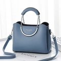 Detail of blue leather bag featuring silver metal handle and chain link attachment - Blue Gold