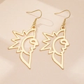 Macro detail of gold sun face earrings featuring hollow artistic geometric design - Gold Yellow