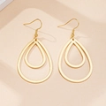 Detail of gold double-layer hollow teardrop earrings with polished finish and fishhooks - Gold Yellow